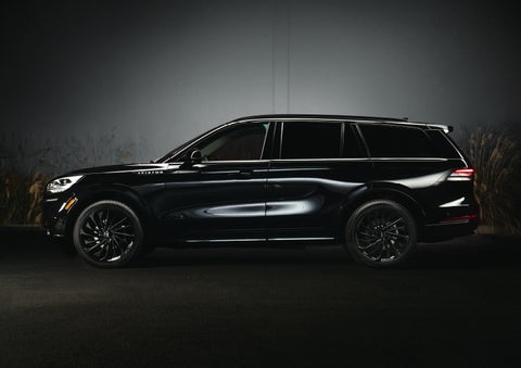 A 2024 Lincoln Aviator® SUV is shown in the Infinite Black exterior color | Empire Lincoln of Huntington in Huntington NY
