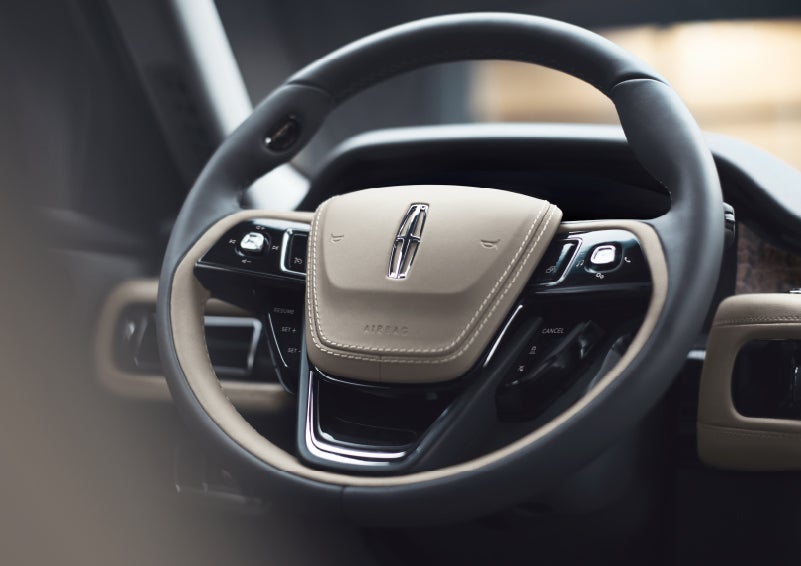 The intuitively placed controls of the steering wheel on a 2024 Lincoln Aviator® SUV | Empire Lincoln of Huntington in Huntington NY