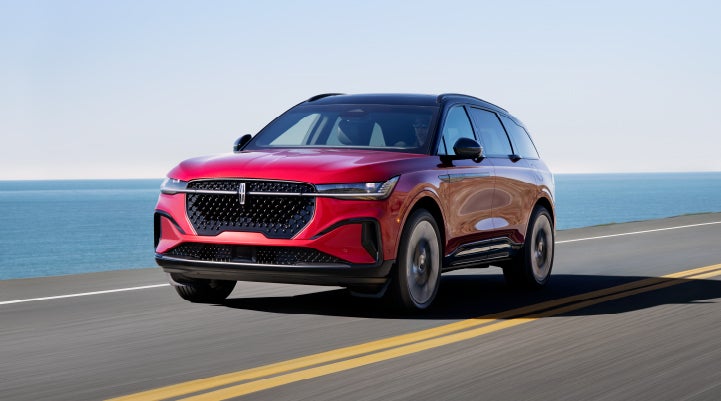 A 2024 Lincoln Nautilus® SUV is being driven on a seaside roadway. | Empire Lincoln of Huntington in Huntington NY