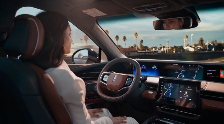 A person is shown driving hands-free on the highway with available Lincoln BlueCruise technology. | Empire Lincoln of Huntington in Huntington NY