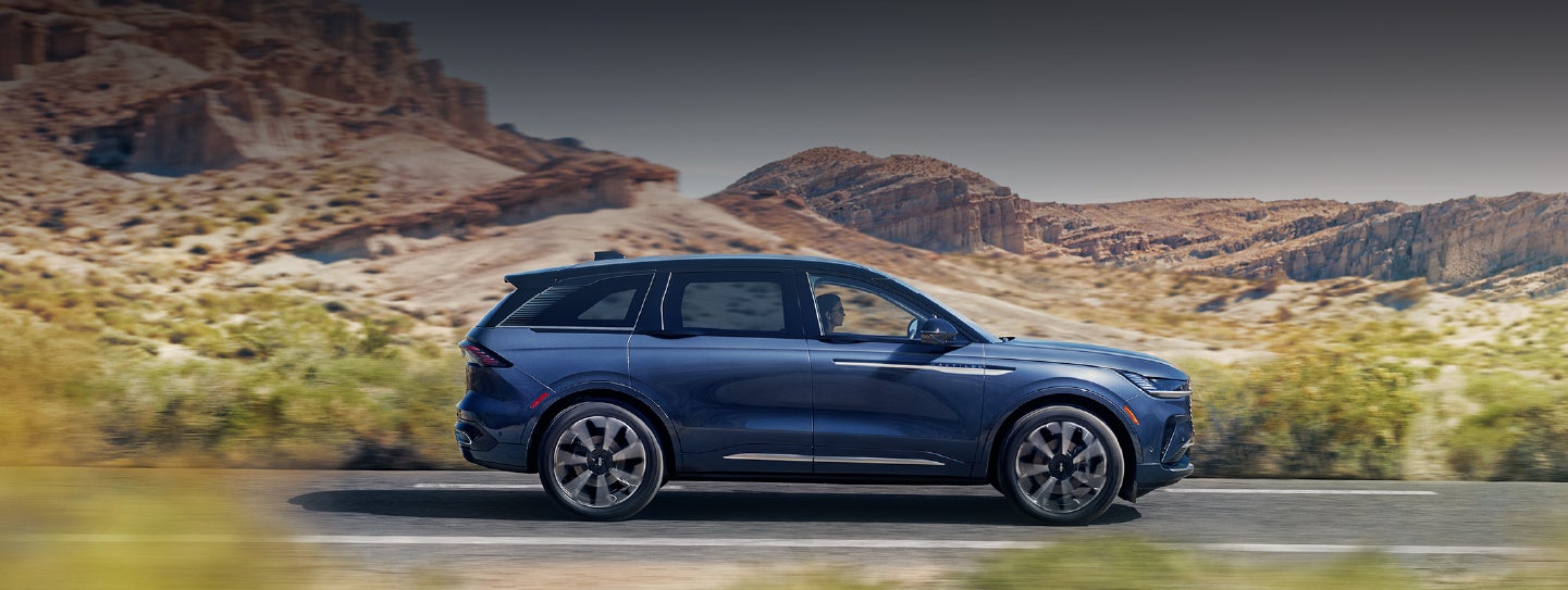 A 2024 Lincoln Nautilus® SUV is being driven in a desert setting. | Empire Lincoln of Huntington in Huntington NY