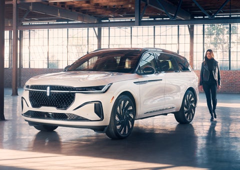 A person approaches a 2024 Lincoln Nautilus® SUV. | Empire Lincoln of Huntington in Huntington NY