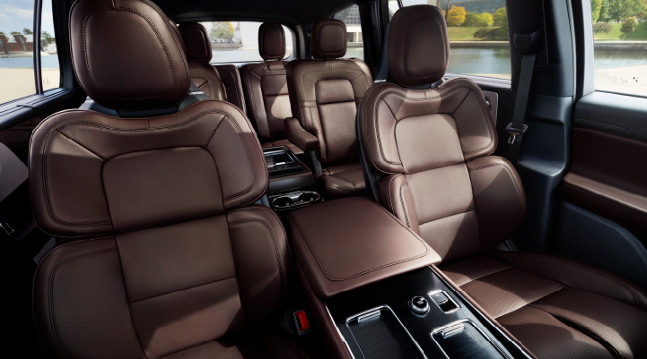 The cabin of the 2025 Lincoln Aviator® SUV is shown with black and brown accents. | Empire Lincoln of Huntington in Huntington NY