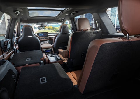 The interior of the 2025 Lincoln Aviator® SUV is shown with two seats folded down for added space. | Empire Lincoln of Huntington in Huntington NY