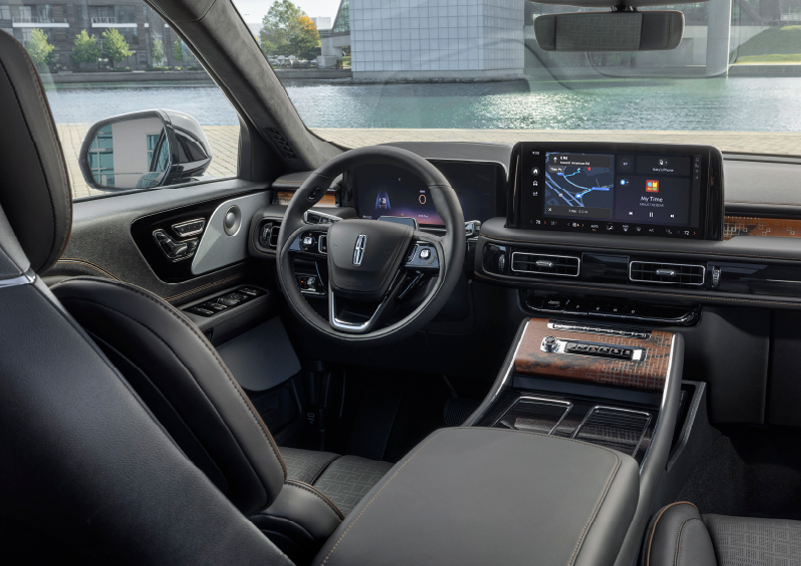 The interior of the 2025 Lincoln Aviator® SUV is shown parked with a view of a harbor through the windshield. | Empire Lincoln of Huntington in Huntington NY