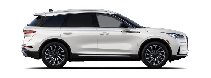 The passenger side of a Lincoln Corsair® SUV is shown in the Ceramic Pearl extra-cost exterior paint option. | Empire Lincoln of Huntington in Huntington NY