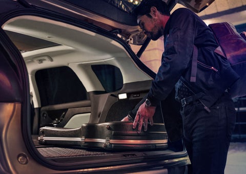 The driver of a 2024 Lincoln Corsair® SUV is shown selecting the drive mode. | Empire Lincoln of Huntington in Huntington NY