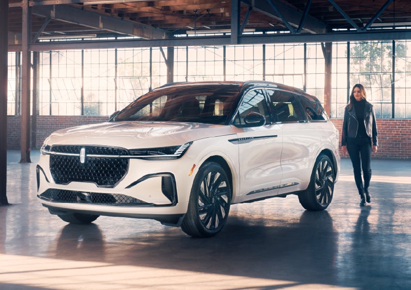 A person approaches a 2025 Lincoln Nautilus® SUV. | Empire Lincoln of Huntington in Huntington NY