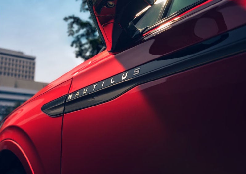 A side badge on the passenger door reads Nautilus. | Empire Lincoln of Huntington in Huntington NY