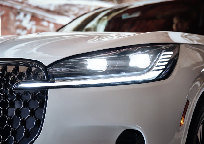 A close-up of a headlamp on the 2026 Lincoln Aviator® SUV is shown. | Empire Lincoln of Huntington in Huntington NY