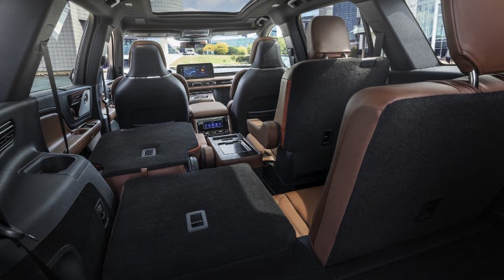 One side of the PowerFold® third-row seat and a second-row seat are folded forward in the 2026 Lincoln Aviator® SUV. | Empire Lincoln of Huntington in Huntington NY