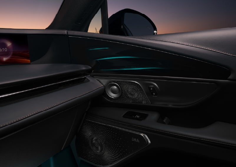 Selectable ambient lighting glows in the passenger door panel. | Empire Lincoln of Huntington in Huntington NY