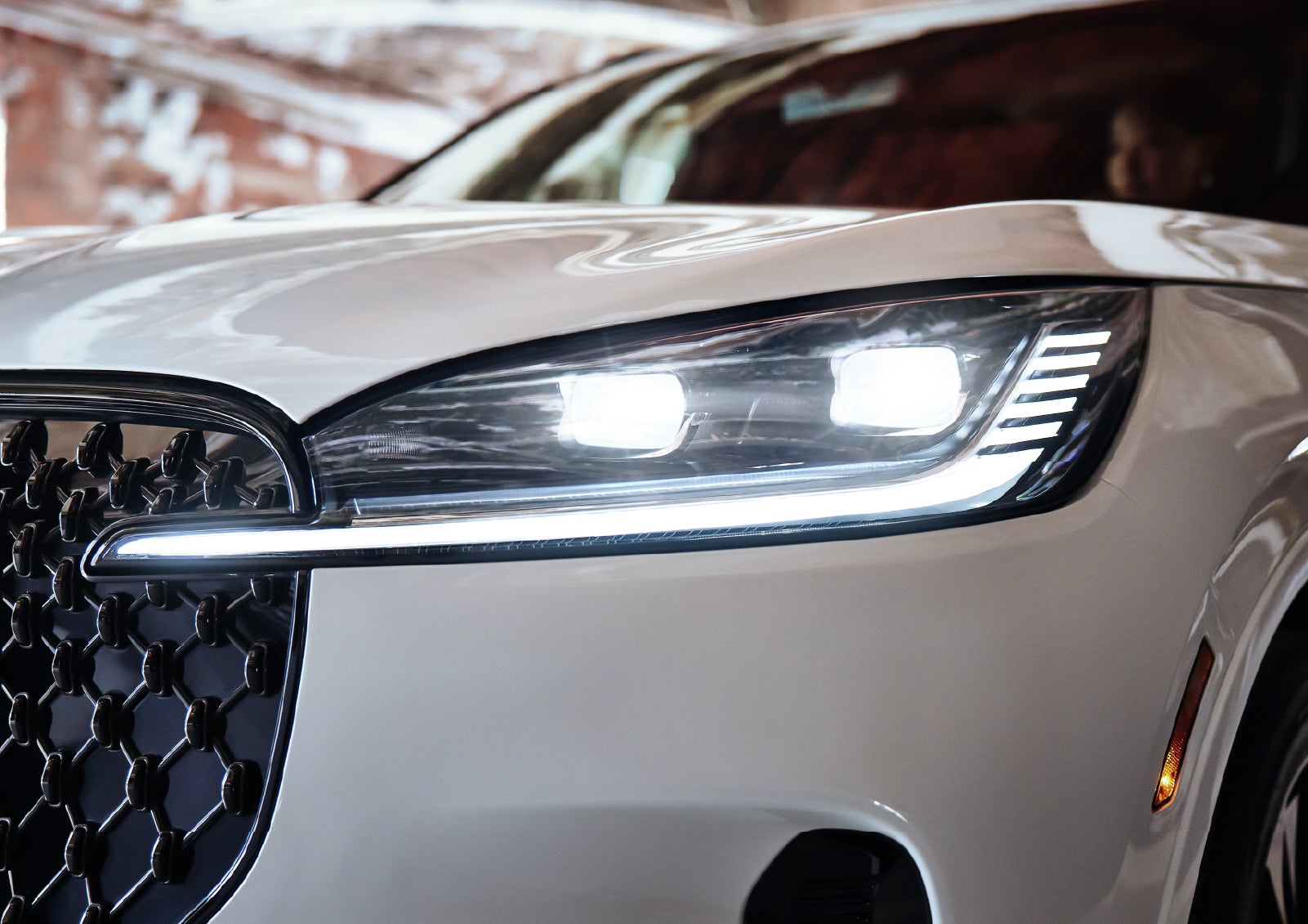 A close-up of a headlamp on the 2027 Lincoln Aviator® SUV is shown. | Empire Lincoln of Huntington in Huntington NY