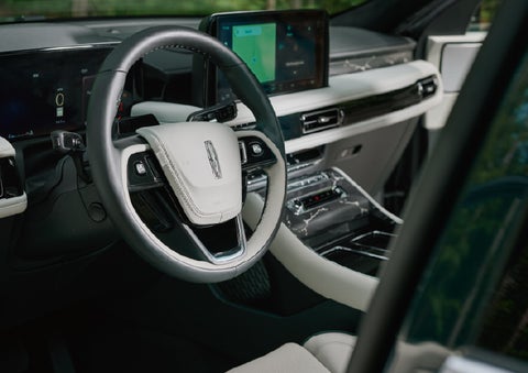 The leather-trimmed steering wheel of a 2027 Lincoln Aviator® Black Label™ SUV. | Empire Lincoln of Huntington in Huntington NY