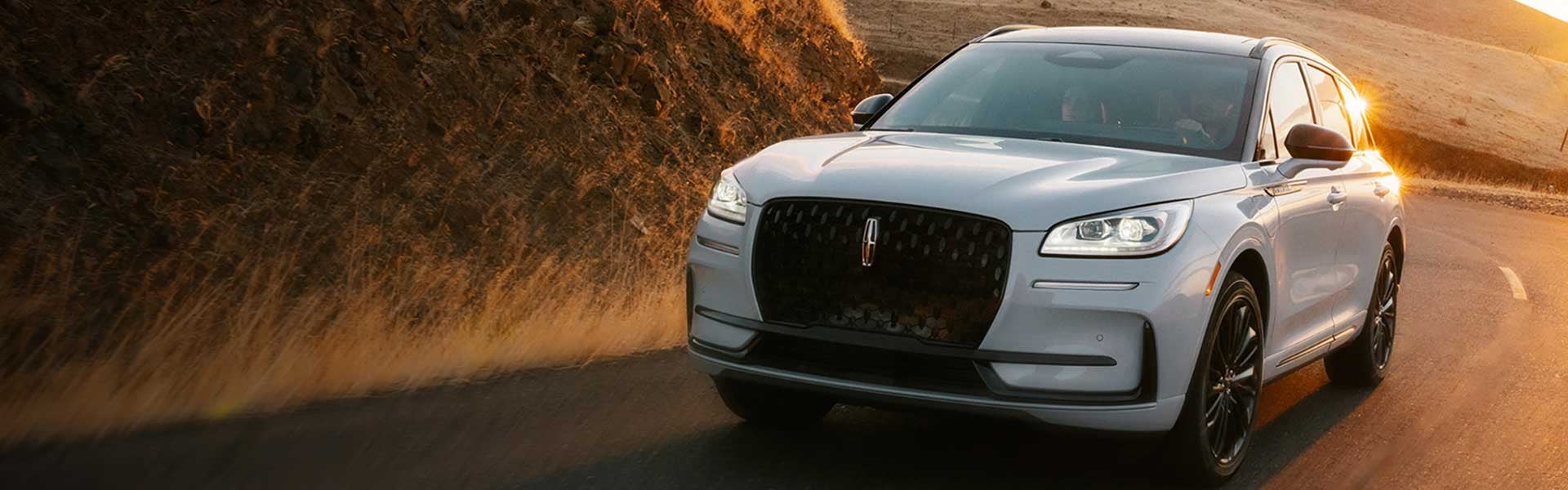 The Lincoln Corsair® SUV driving down a curvy road.